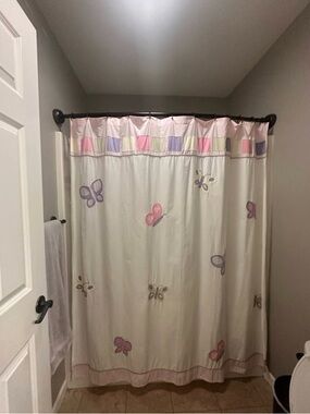 Butterfly Print Shower Curtain, 3 wall hangings, and 2 bathroom mats included.